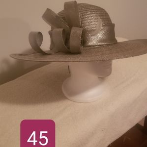 Silver, wide-brimmed hat w/ satin ribbon wrapped around the brim.
